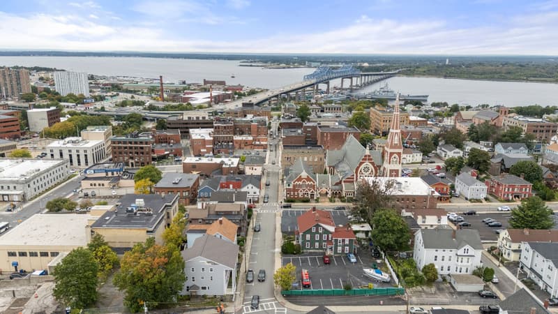 Aerial view of the Bank Street block with the river and the Braga Bridge behind